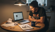 Man searching vintage metal shirts online
