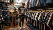 Person examining vintage metal tee tag