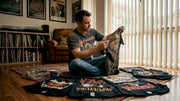 Collector reviewing vintage heavy metal shirts