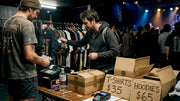 Concertgoer browsing shirts at merch table