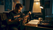 Collector authentically examining vintage band shirt