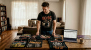 Collector sorting vintage metal band t-shirts