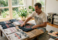 Collector arranging vintage 90s band shirts