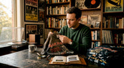 Collector examining vintage metal tour shirt