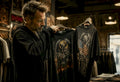 Collector comparing US and EU tour shirts in vintage store