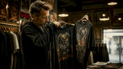 Collector comparing US and EU tour shirts in vintage store