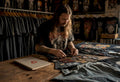 Collector examining vintage heavy metal t-shirts