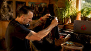 Collector inspecting vintage metal band shirt