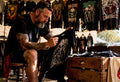 Collector inspecting a vintage band shirt closely