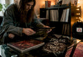 Collector inspecting metal vinyl and shirt set