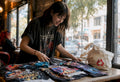 Music fan browsing limited edition tour shirts