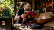Collector examining rare vinyl and t-shirt bundle