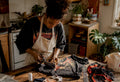 Woman crafting upcycled band tee tote bag