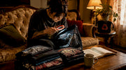 Collector examining vintage licensed tour shirt