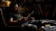 Collector browsing vintage heavy metal merchandise