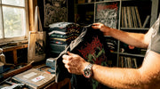 Close-up hands holding vintage death metal shirt