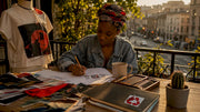 Fashion designer sketching concept tee designs