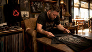 Collector examining limited run metal shirt