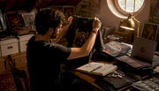 Collector examining single-stitch vintage shirt