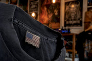 Close-up of vintage metal tee neck tag