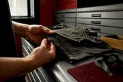 Collector examining vintage T-shirt construction