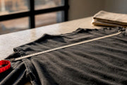 Tape measuring vintage garment width