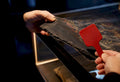 Anonymous vintage tee being assessed at auction